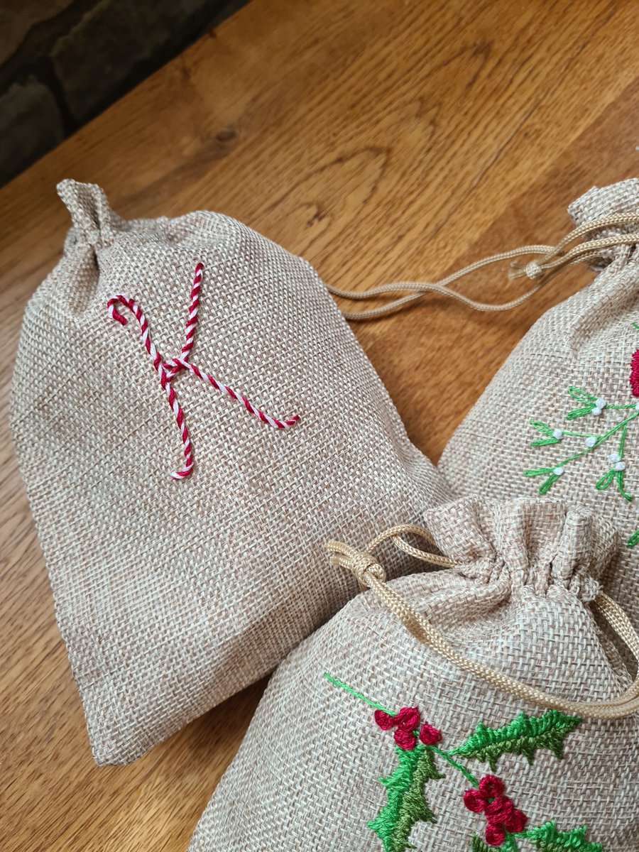 Christmas hand embroidered with a personalised candy cane inital gift bags