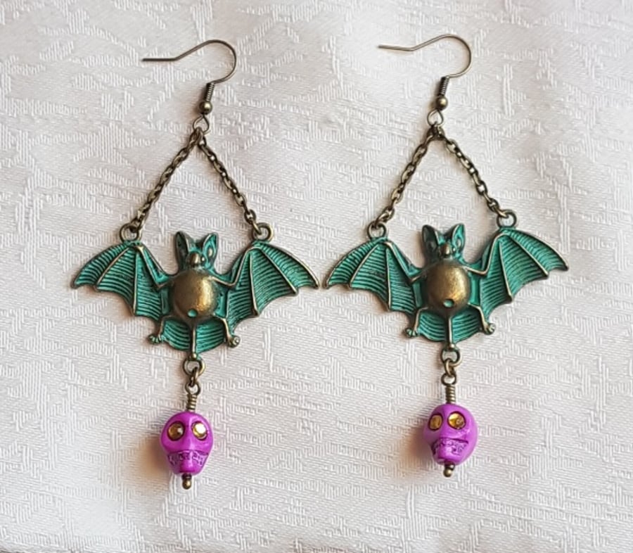 Spooky Antique-look Bat Earrings with Pink Skulls.