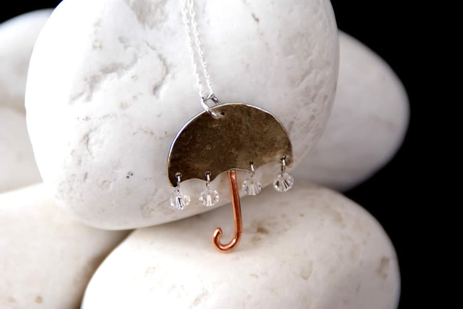 Silver umbrella pendant with raindrops
