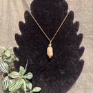 Beautiful wire wrapped pebble pendant on gold coloured chain. 