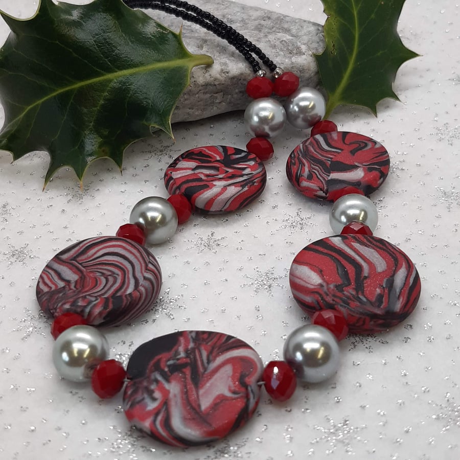 Red and black disc shaped polymer clay necklace 