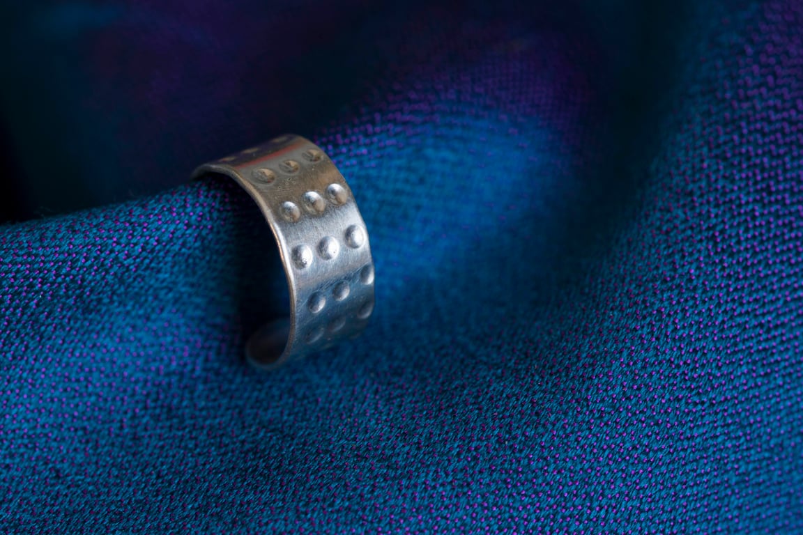 Slim silver ear cuff with a "dimpled" design