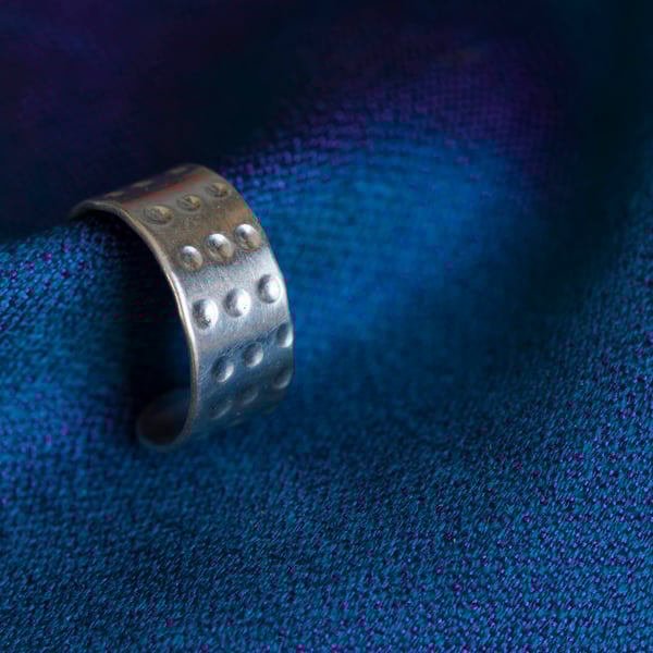 Slim silver ear cuff with a "dimpled" design