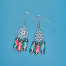 Multicoloured Paper beaded earrings on a mandala shaped finding