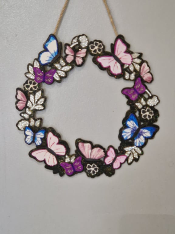 Wooden flower and butterfly wreath. 