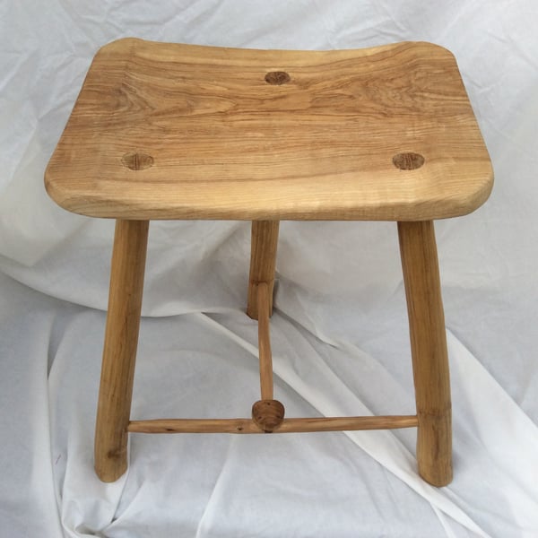  Three-legged stool with a rectangular seat