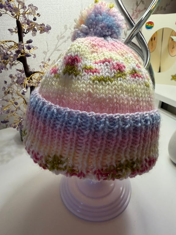 Hand knitted baby hat with rib and  Pom Pom.