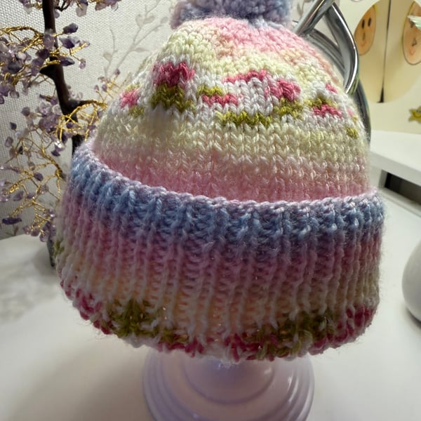 Hand knitted baby hat with rib and  Pom Pom.