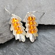 Leaf earrings in etched pewter with amber stones and sterling silver ear hooks