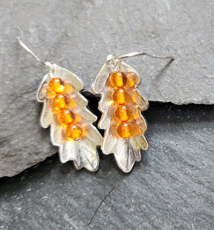 Leaf earrings in etched pewter with amber stones and sterling silver ear hooks