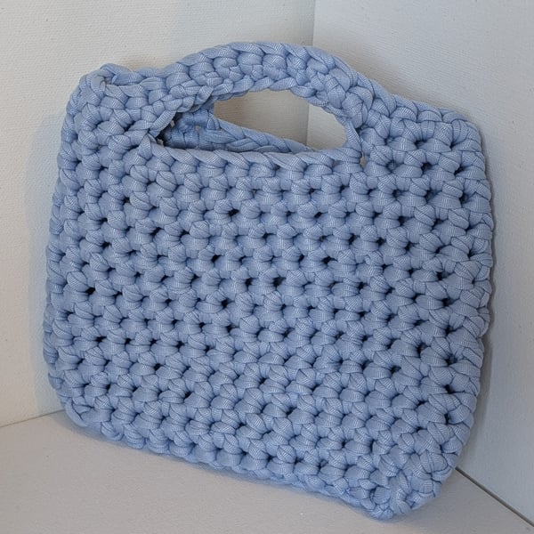 Handmade crochet bag made with light blue t-shirt yarn 