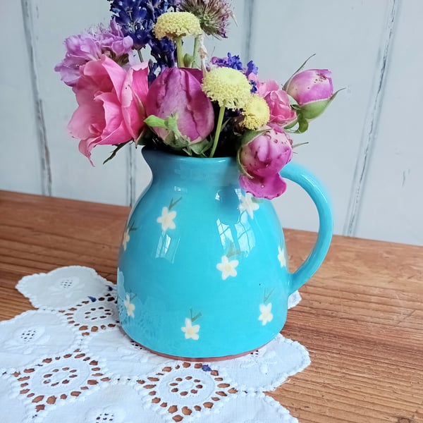Light blue jug with white flower design