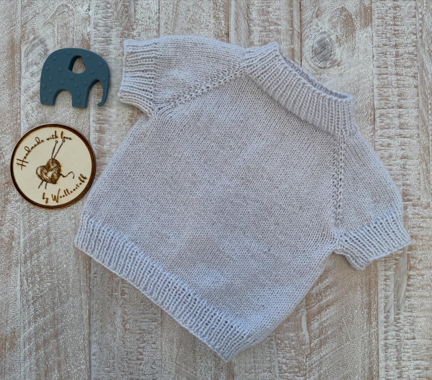 In Stock Handknitted Spring Short Sleeved Baby Jumper 6-9 months. Icy Grey.