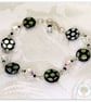Bracelet with black and clear iridescent glass beads, silver plated. - Image 1