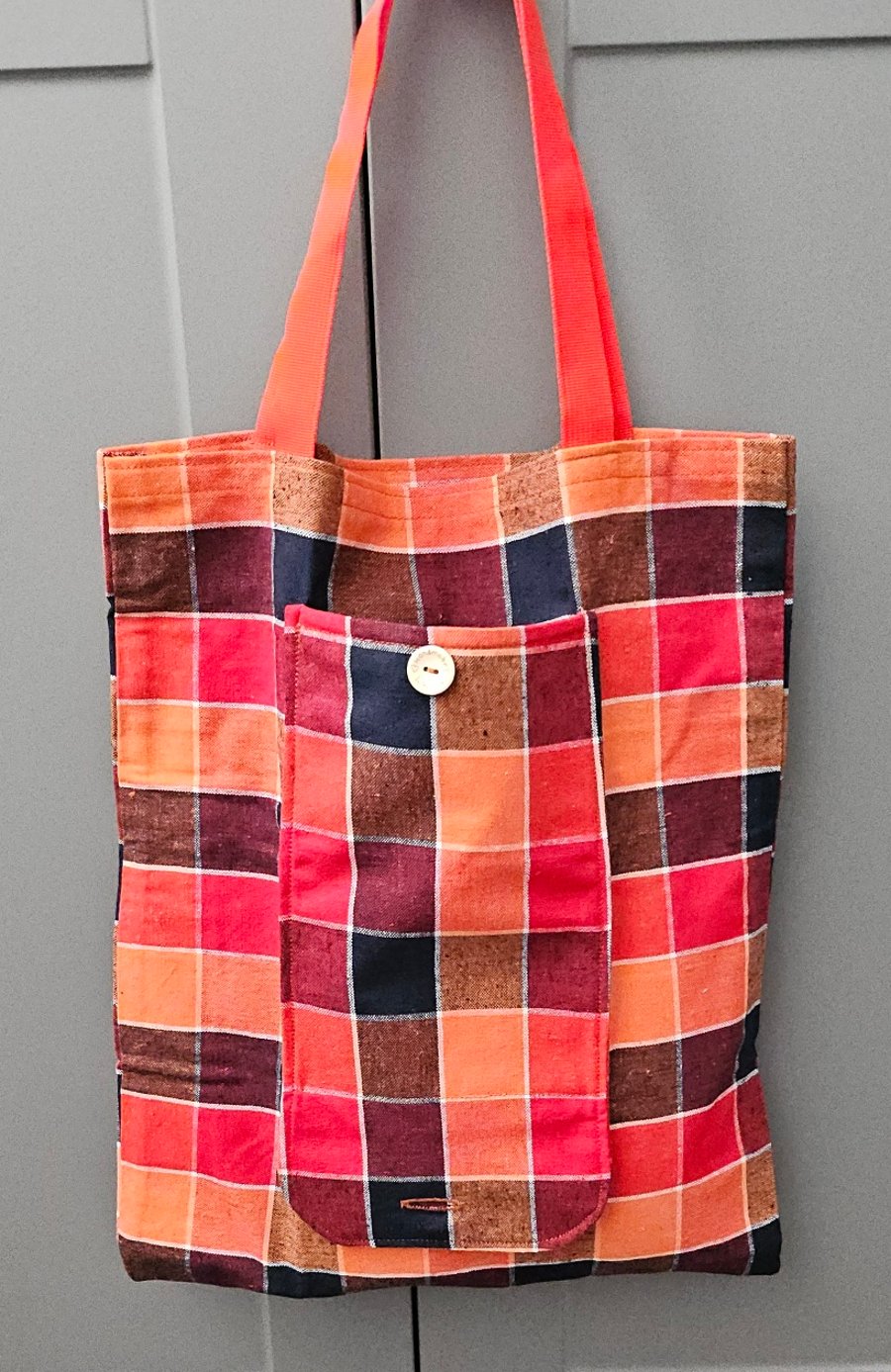 Bright chequed fold up tote bag.