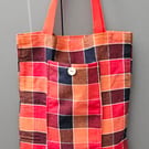Bright chequed fold up tote bag.