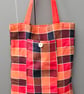 Bright chequed fold up tote bag.