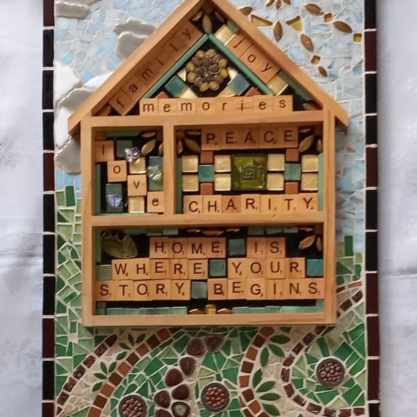 HOME. MOSAIC with words telling of the importance of home.