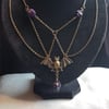 Spooky Antique Bronze Bat Necklace with Purple Skulls.