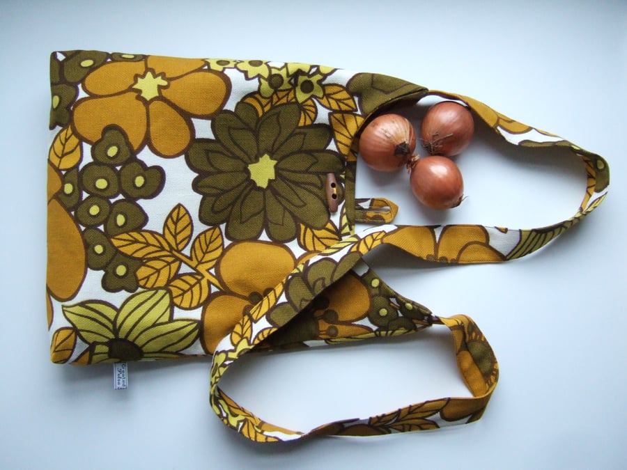 Bold vintage 1970's floral print across your body bag. 