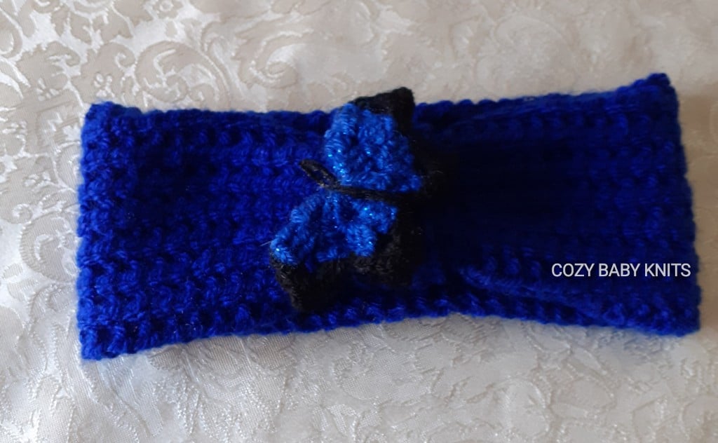 EARWARMER WITH A BUTTERFLY MOTIF