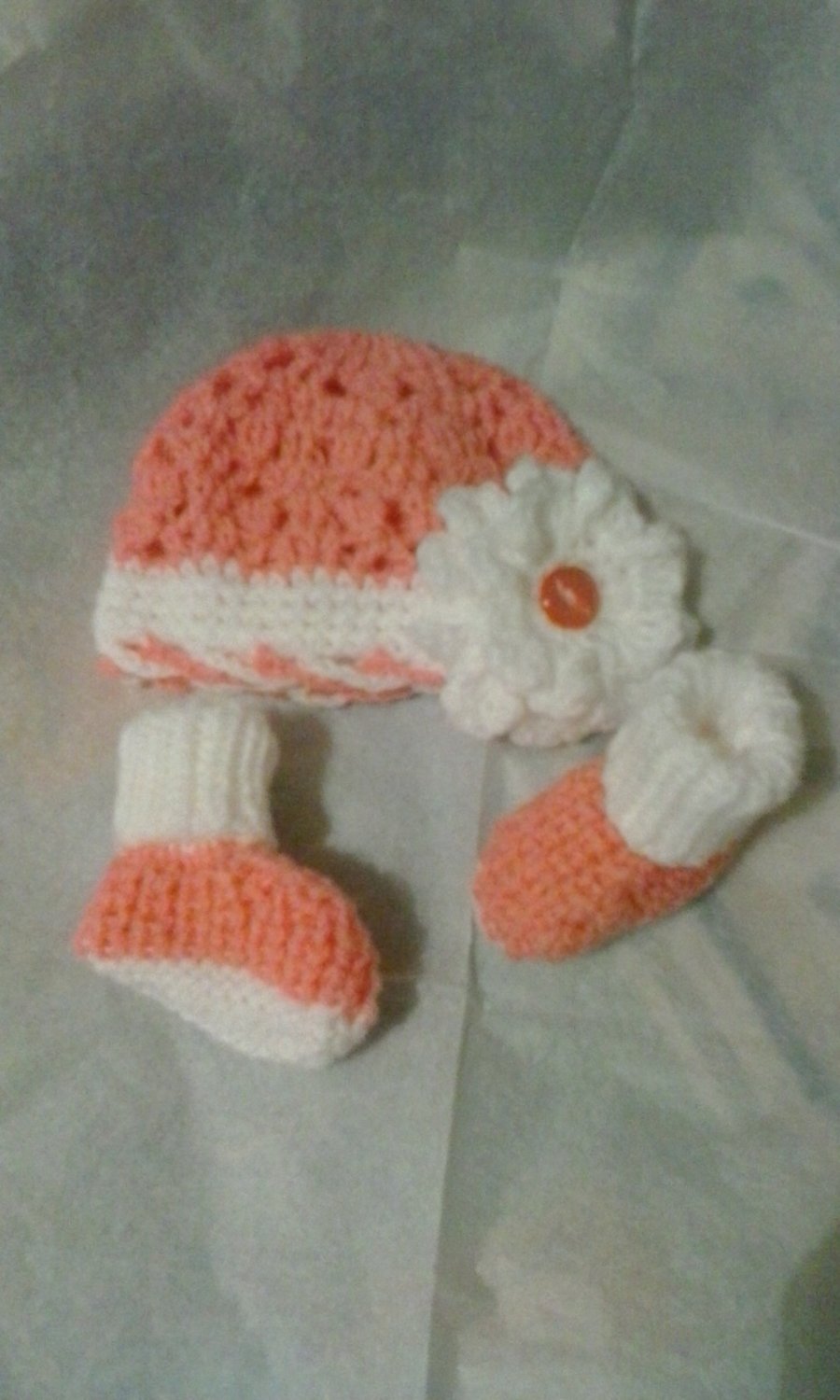 Handknitted baby flower bonnet and booties set 