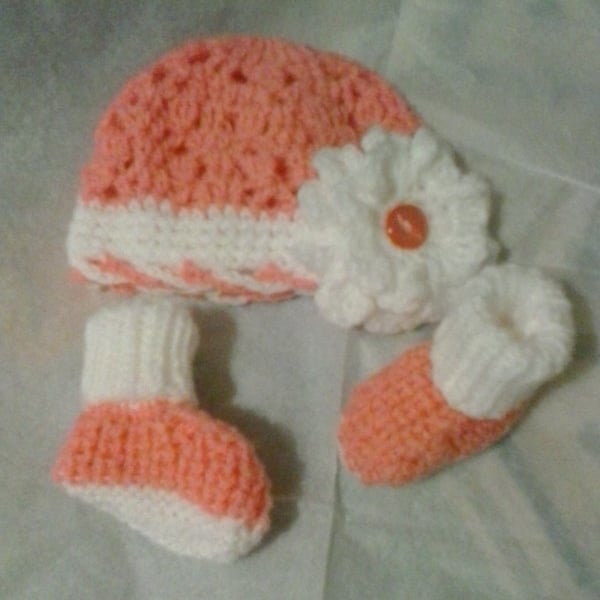 Handknitted baby flower bonnet and booties set 