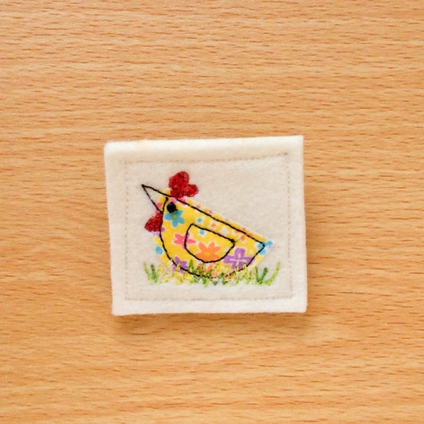 Textile brooch.