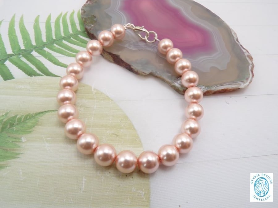 Peach Round Pearl beaded Silver Bracelet.