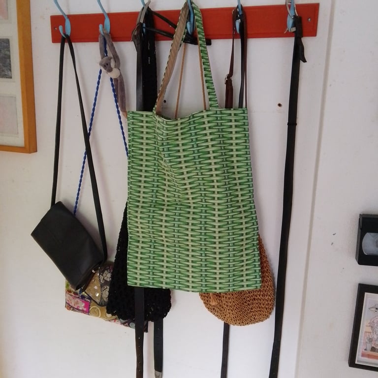 Tote bag made using green basket weave fabric.
