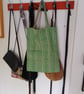 Tote bag made using green basket weave fabric.