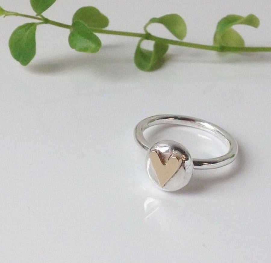 Silver ring with 9ct gold heart