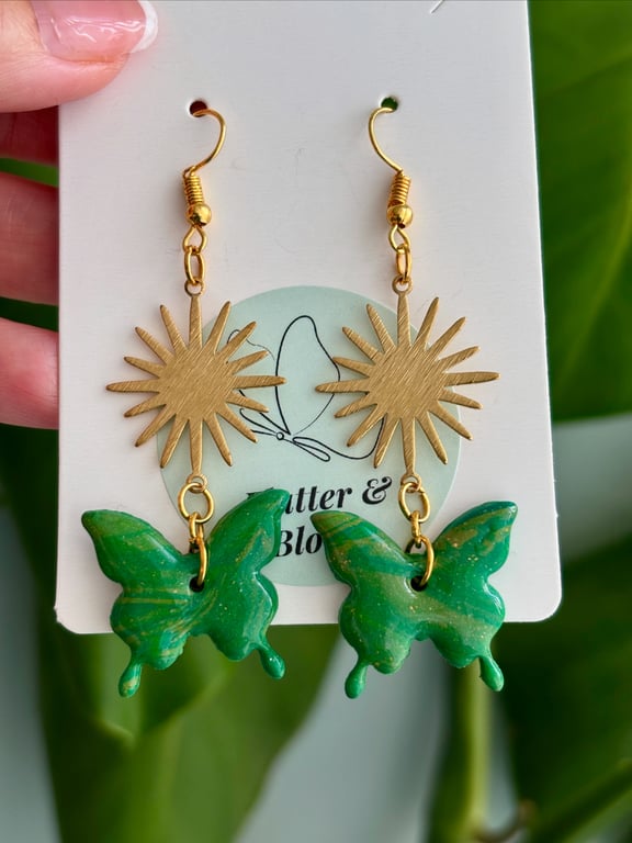 Sunburst and butterfly dangling earrings green and gold