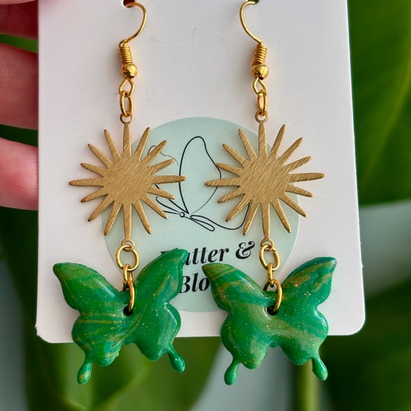 Sunburst and butterfly dangling earrings green and gold