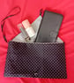 Clutch bag in black and white polka dots - Image 1