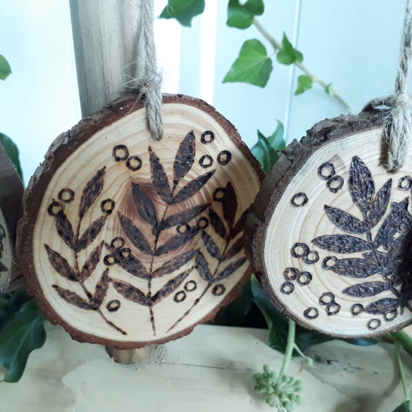 Five pyrography rowan wood slice hanging decorations