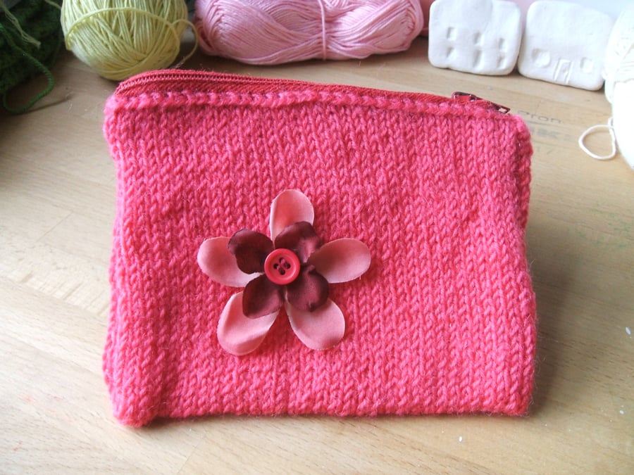 hand knitted small pink zipped purse with red flower detail