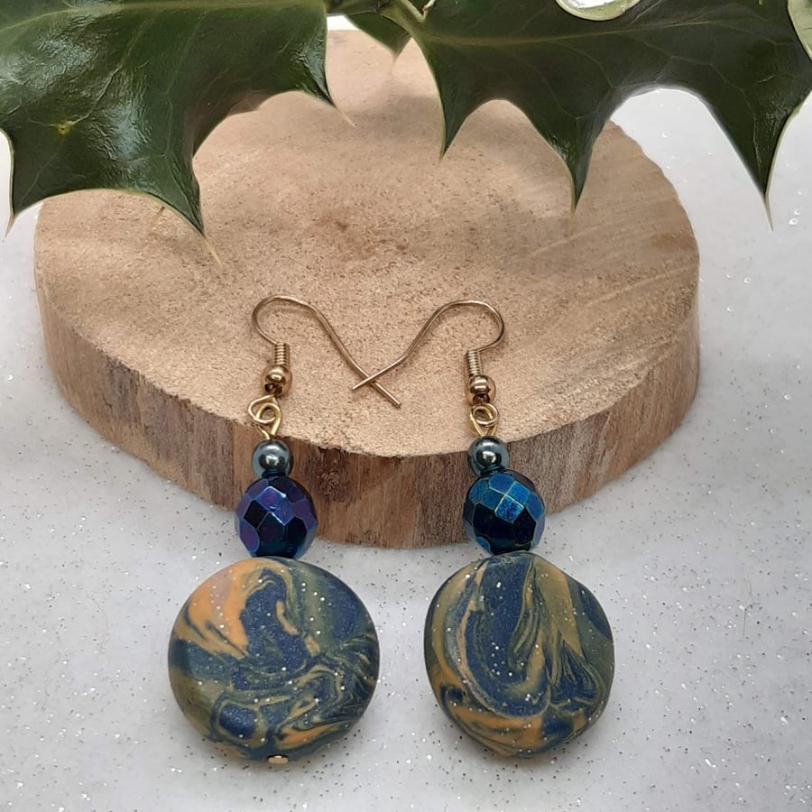 Disc shaped dangly earrings