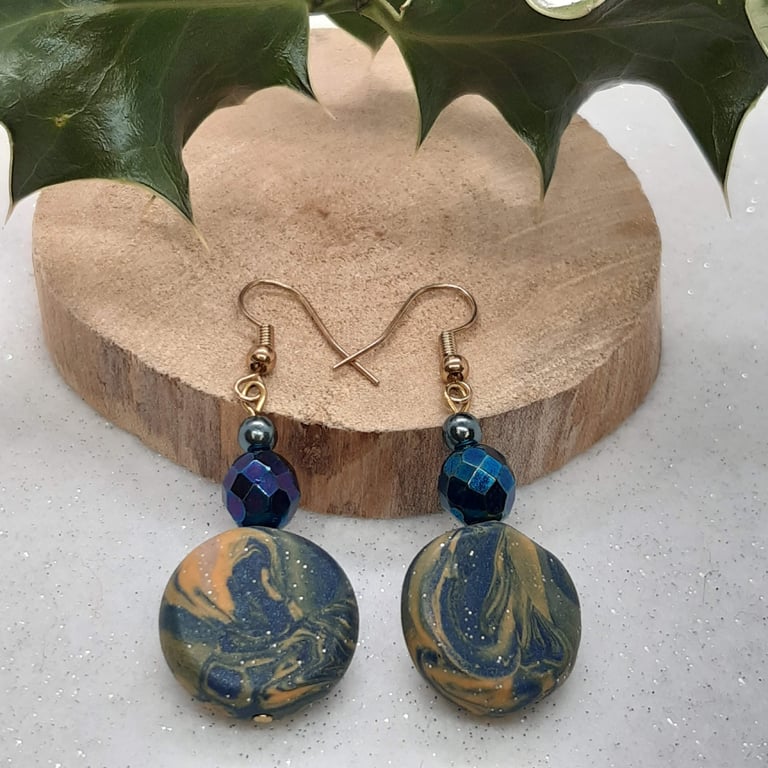 Disc shaped dangly earrings