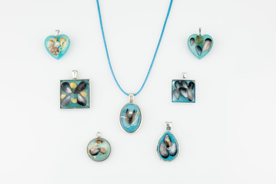 Sea blue beach pendants, resin at its finest.