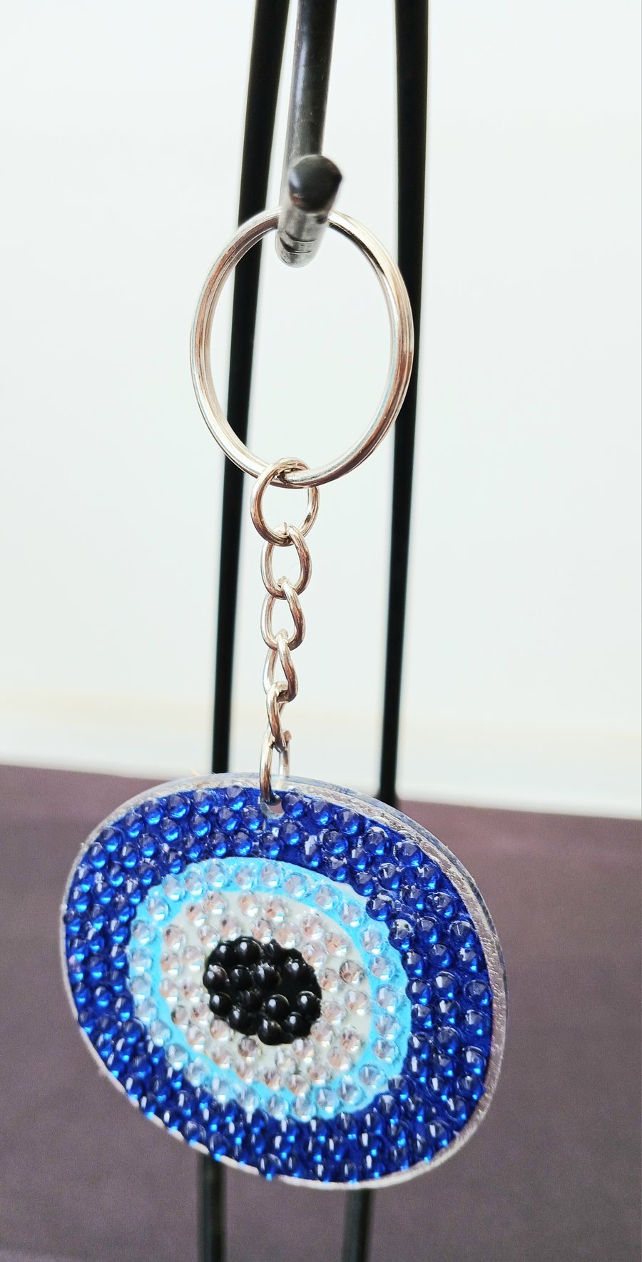 Protective eye keyring 