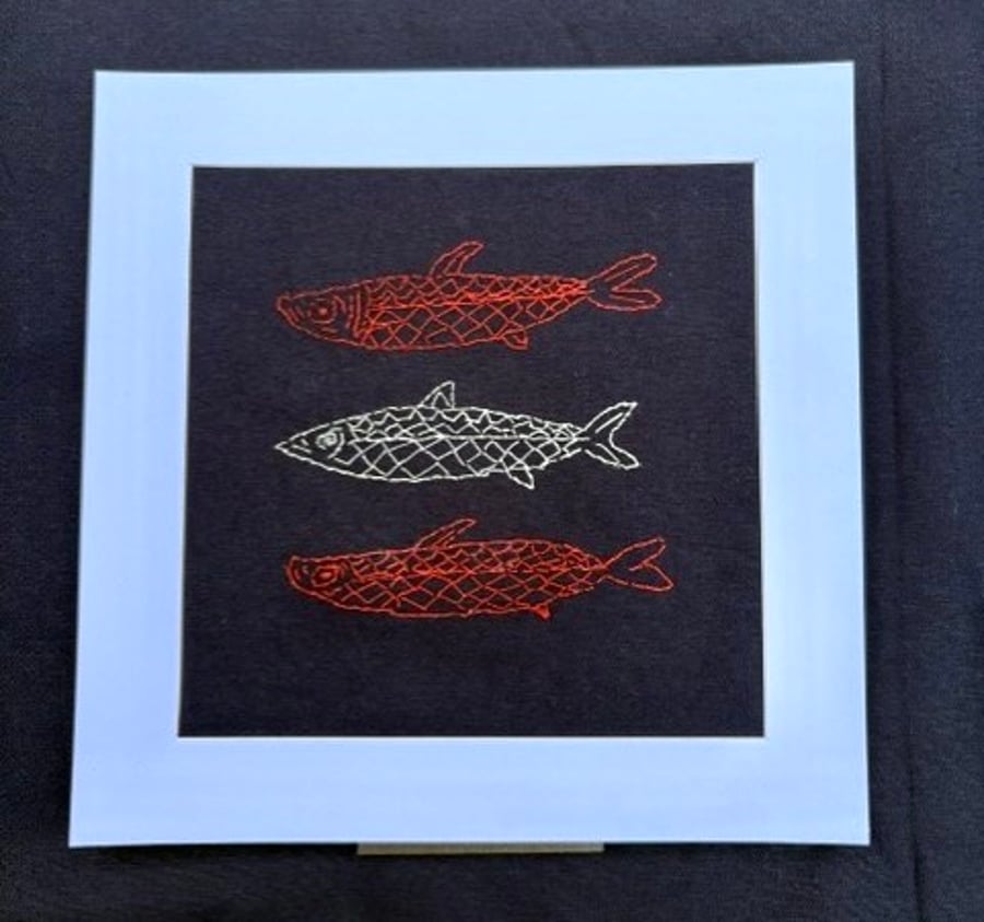 Three fish hand embroidered picture.