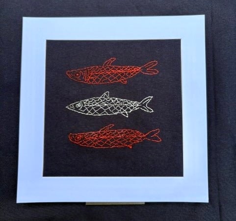 Three fish hand embroidered picture.