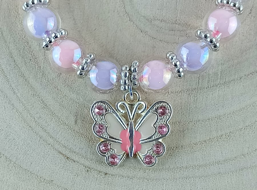 Bracelet - Pink and Lilac beaded bracelet with a butterfly charm
