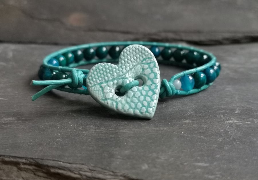 Teal leather and chrysocolla bead bracelet with ceramic heart button fastener