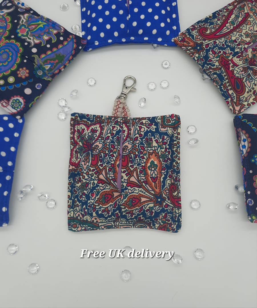 Bag charm sanitary pad holder teal raspberry floral pattern.