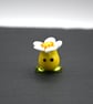 yellow glass flower hear figure