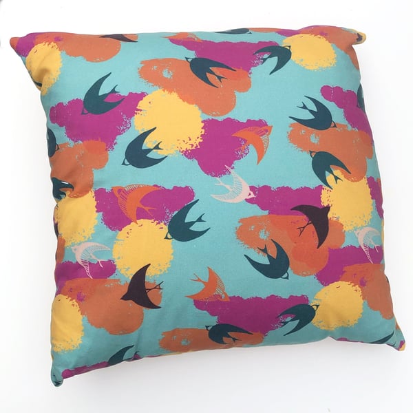 Fly free cushion with colourful bird print 