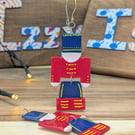 Handmade Nutcracker Soldier, festive polymer clay christmas tree decoration.