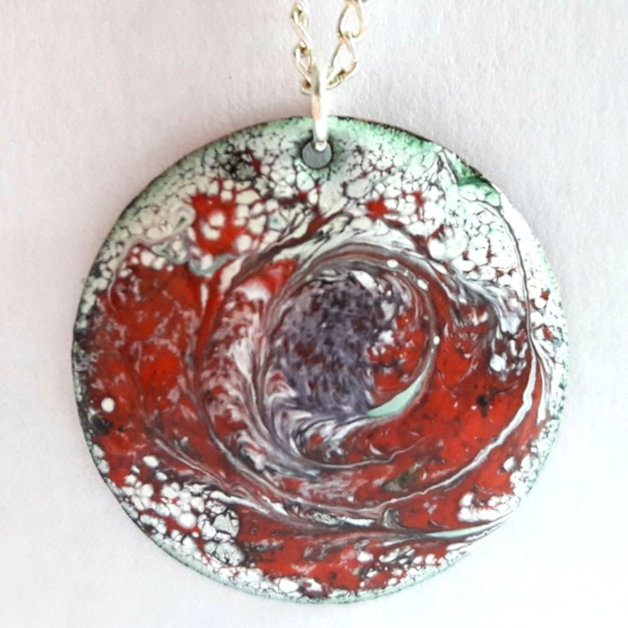 round pendant - scrolled purples and red over white